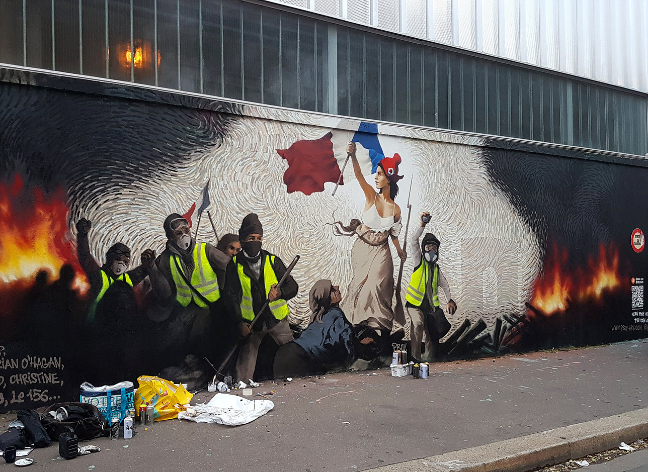 Street Artist Hides $1,000 in BTC Inside a Mural Depicting Paris Protests